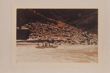 The Nevills San Juan punt with George Wing at the oars is freed from the rock near Johns Canyon.  Mexican Hat gauge:  1190 cfs